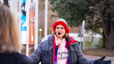 Local guide in Canberra walking with group