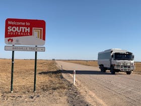 6WD coach driving on the dirt Birdsville Track