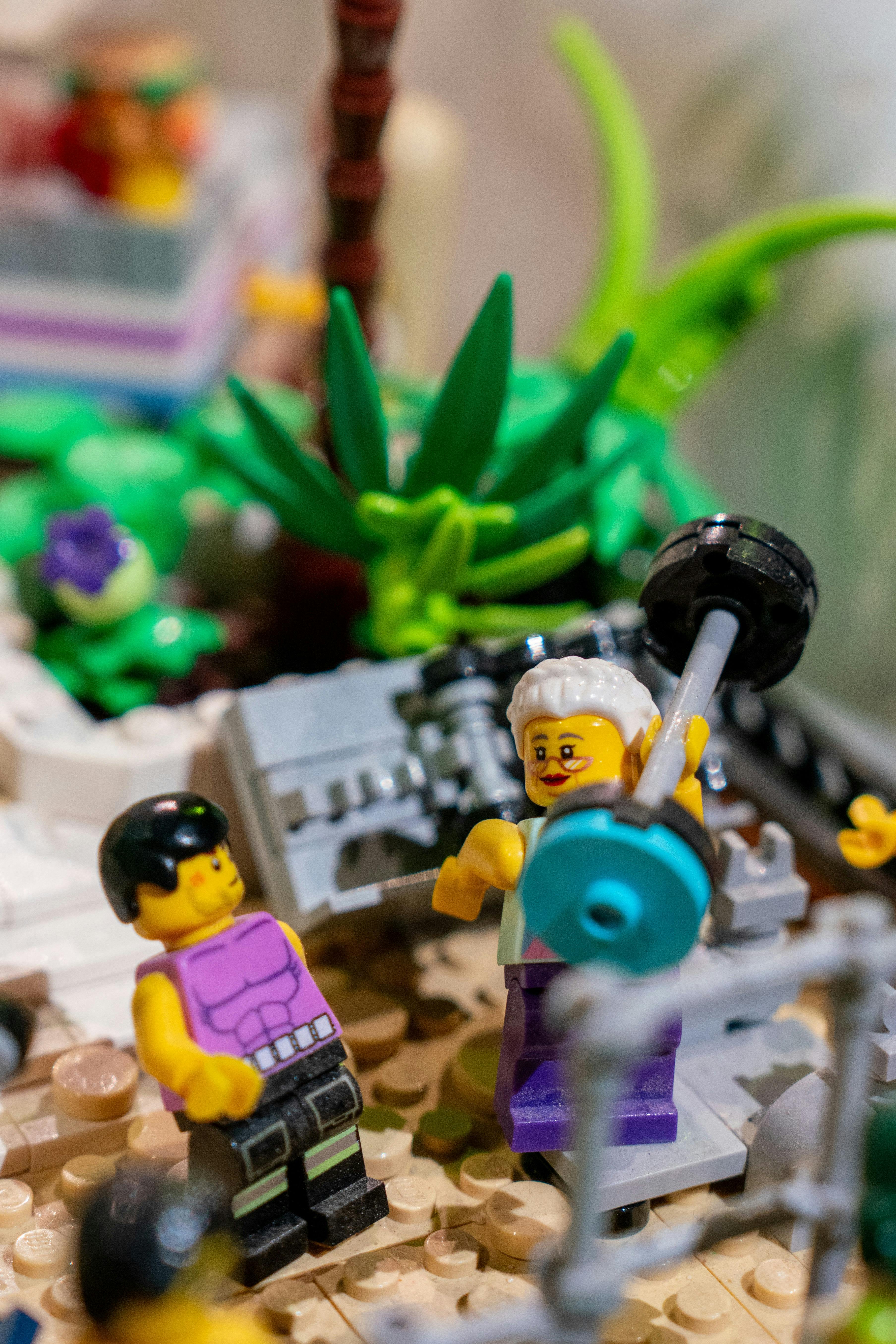 LEGO® minifigure in gym lifting weight in RELICS exhibit