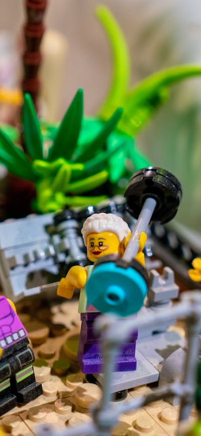 LEGO® minifigure in gym lifting weight in RELICS exhibit
