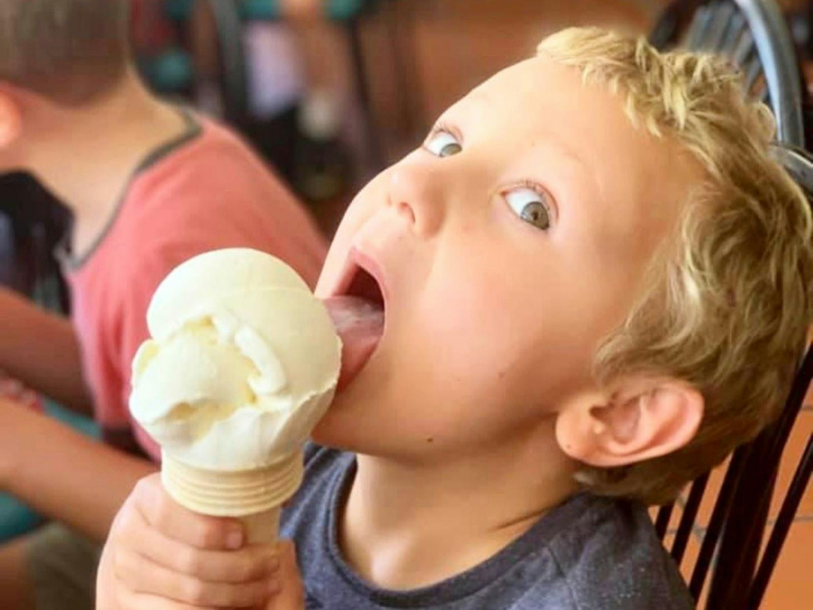 Kid licking ice cream
