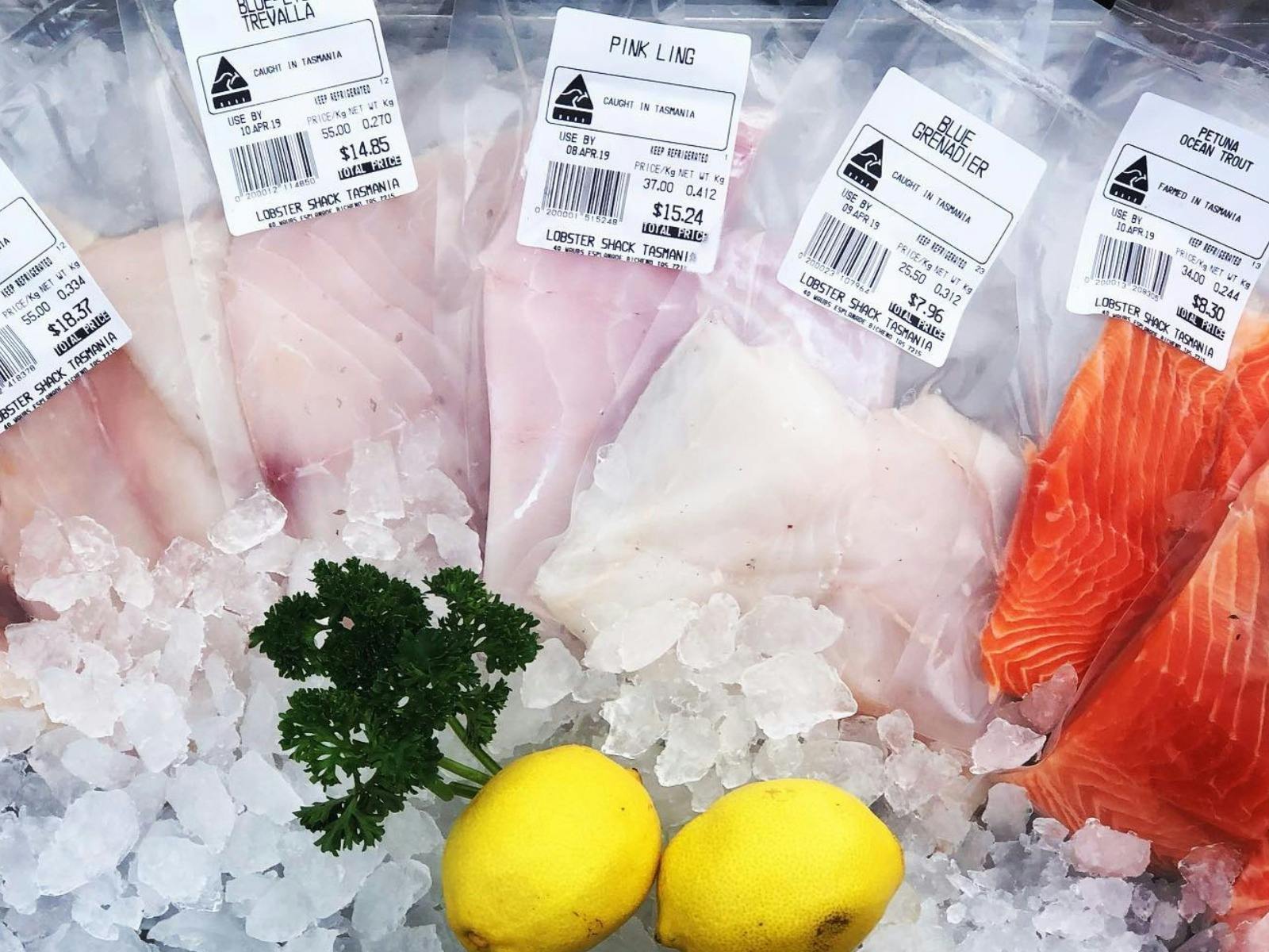 A selection of fresh fillets in ice with lemon