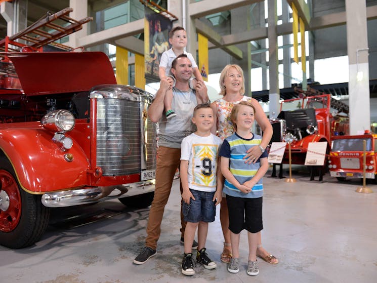 Family standing in the Museum of Fire