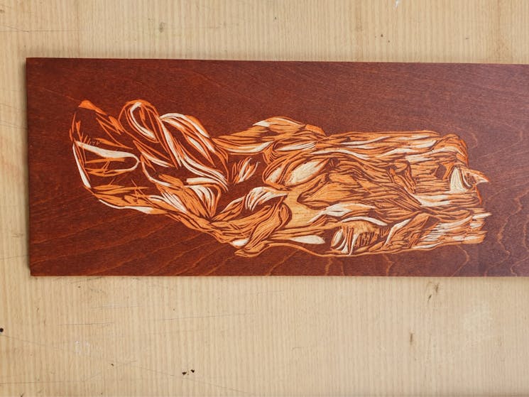 Reduction woodcut block with brown and orange ink