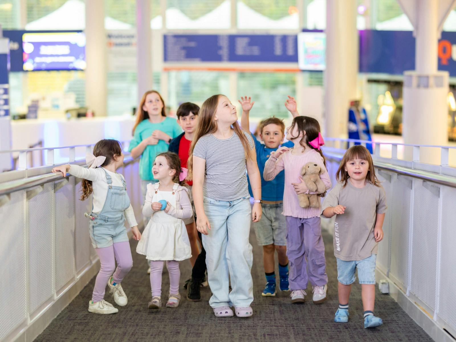 A group of children going up the ramp at Questacon