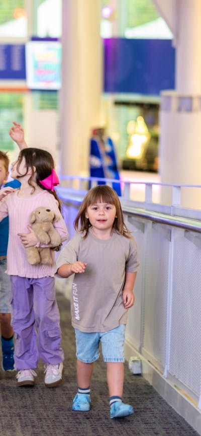A group of children going up the ramp at Questacon