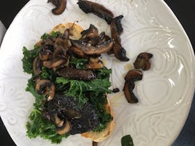Roasted mushrooms and kale on sour dough with lemon and thyme butter