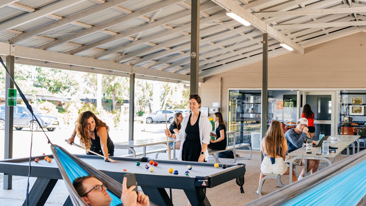 outdoor social area with pooltable and table tennis