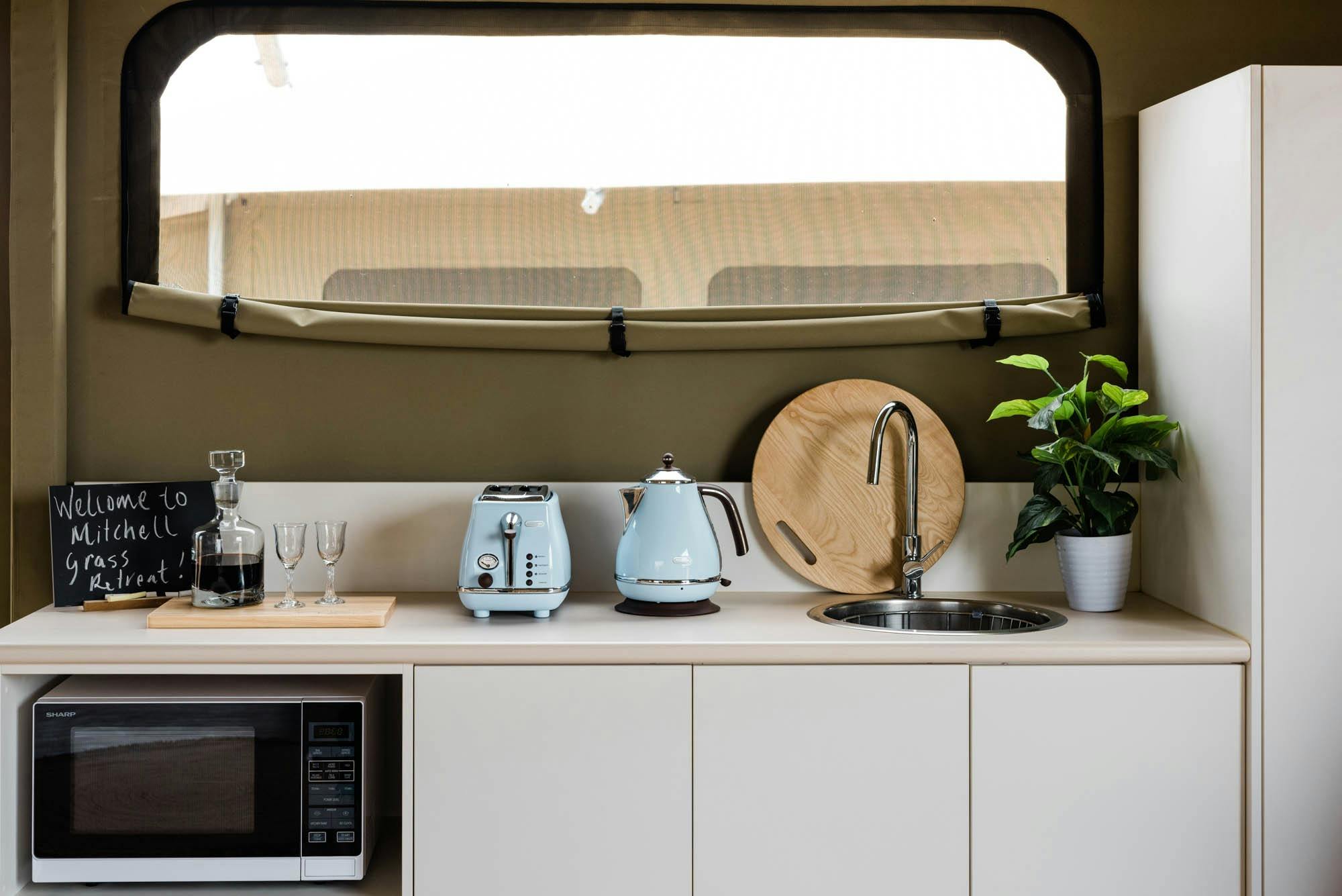 Close up of kitchenette with blue appliances