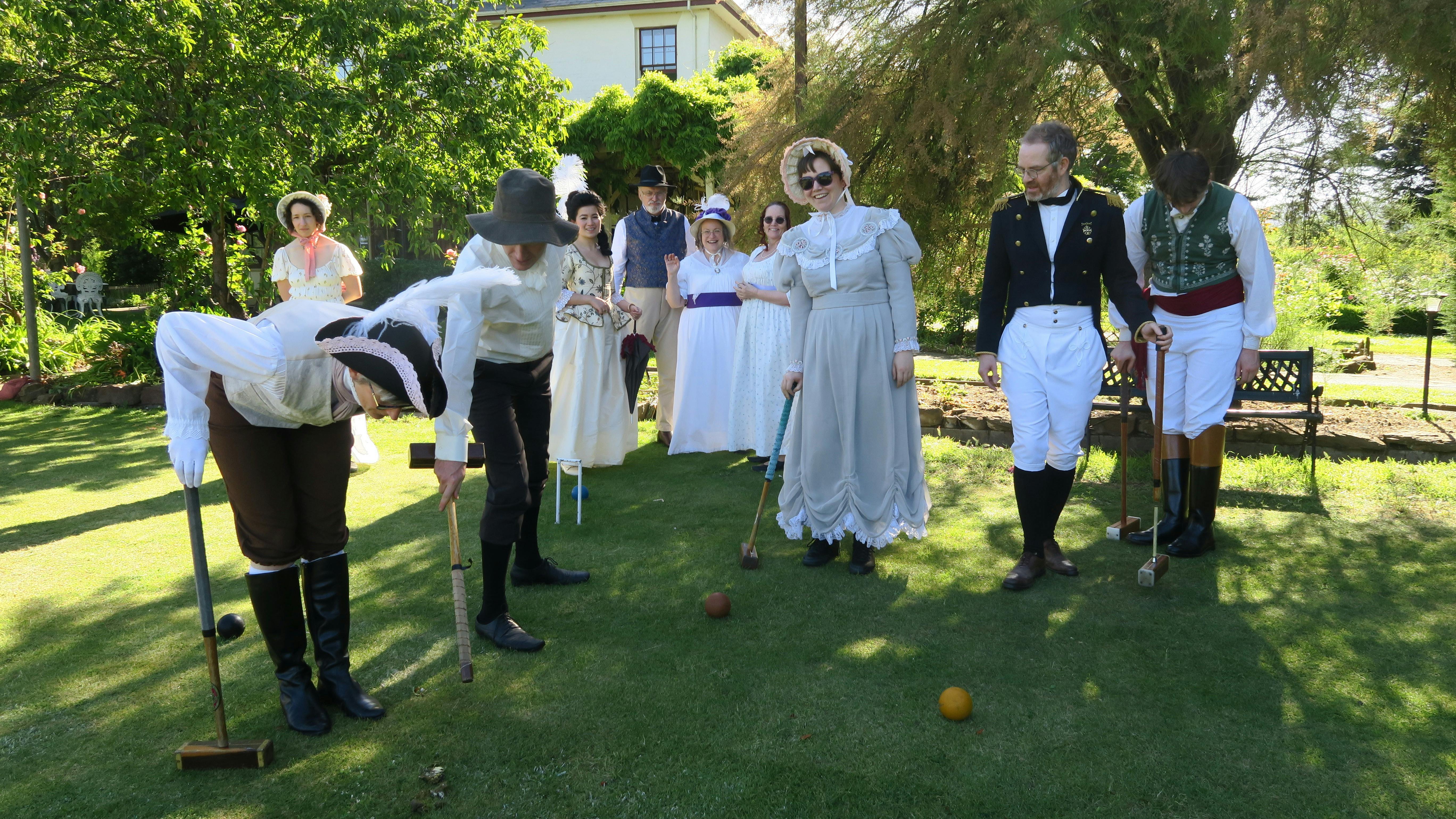people in Regency costumes playing croquet