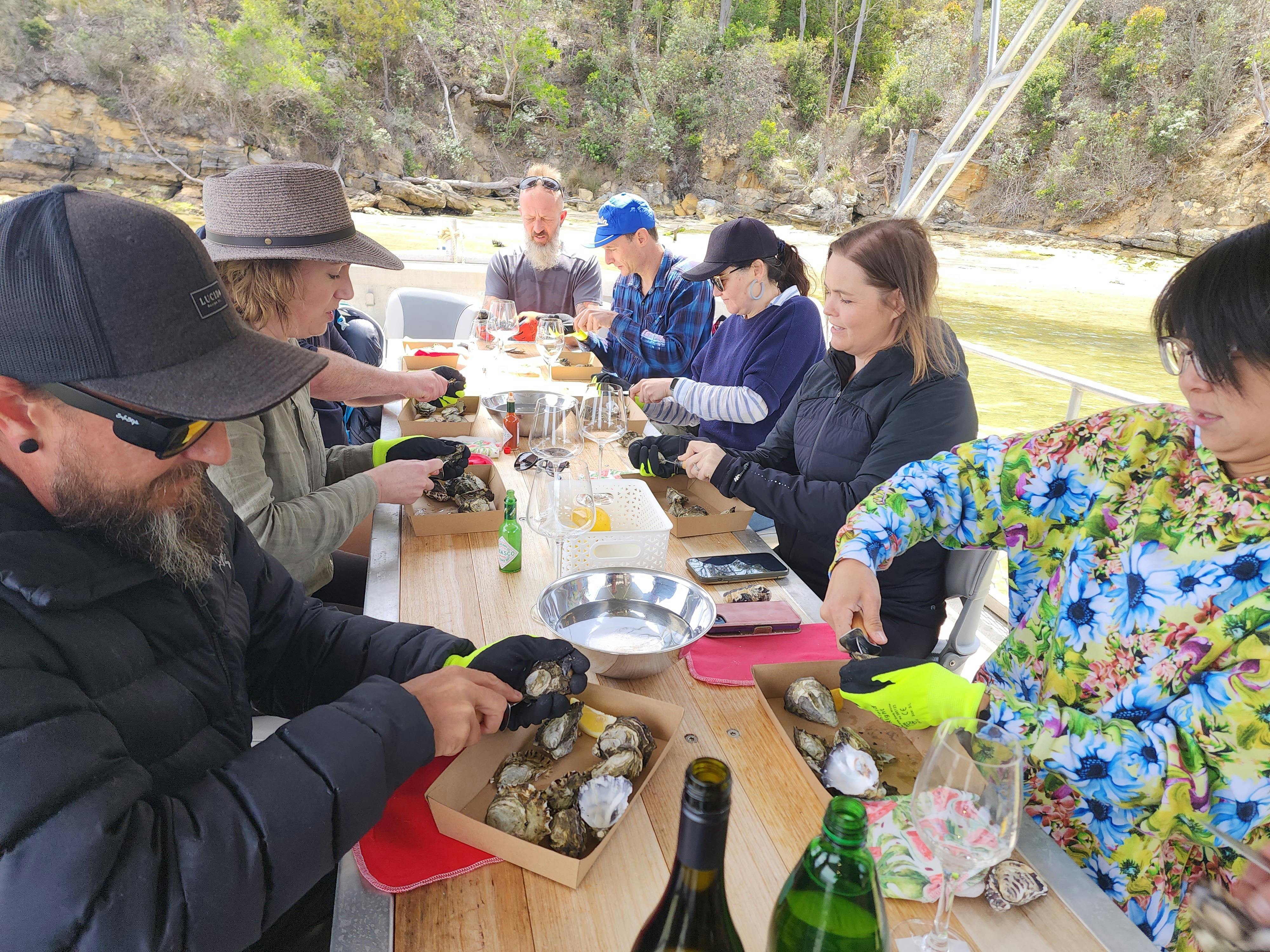 Group actively shucking oysters together