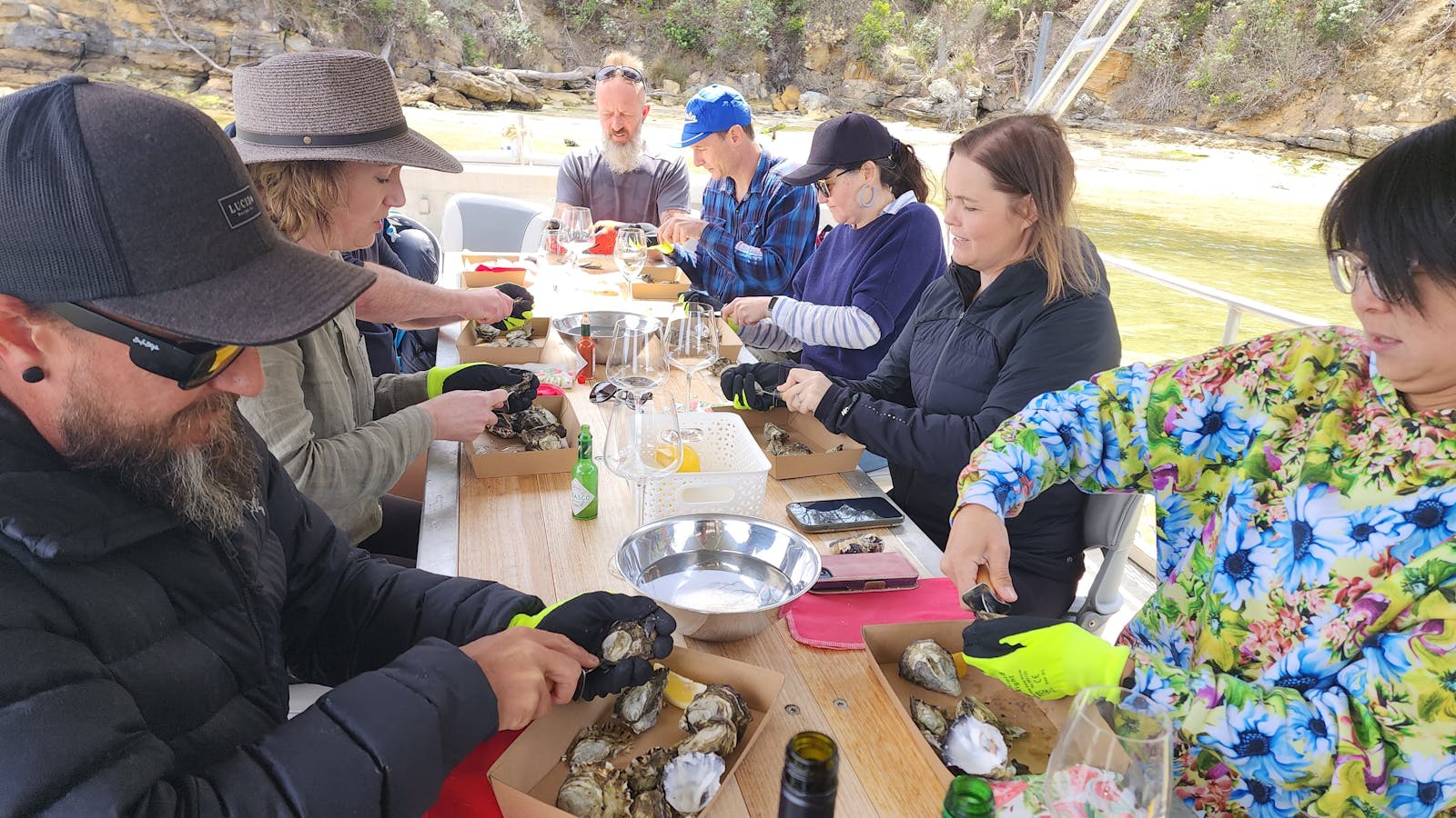 Hands deep in fresh Tasmanian oysters—farm-to-table never felt so immersive