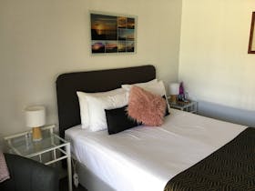 Comfortable queen bed in a cosy room with electric blankets, free wifi and large screen TV