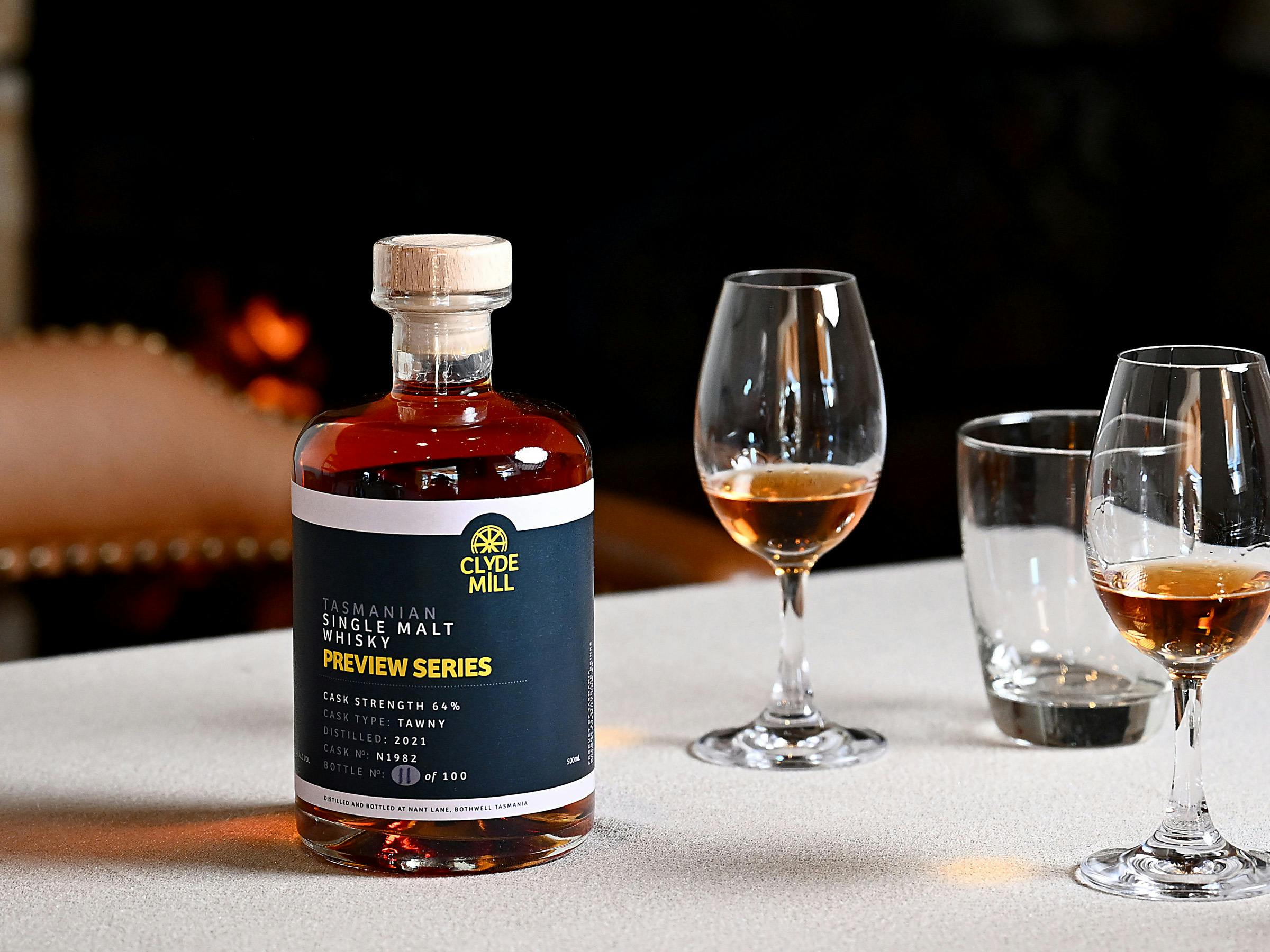 Clyde Mill Preview Series whisky bottle with tasting glasses.