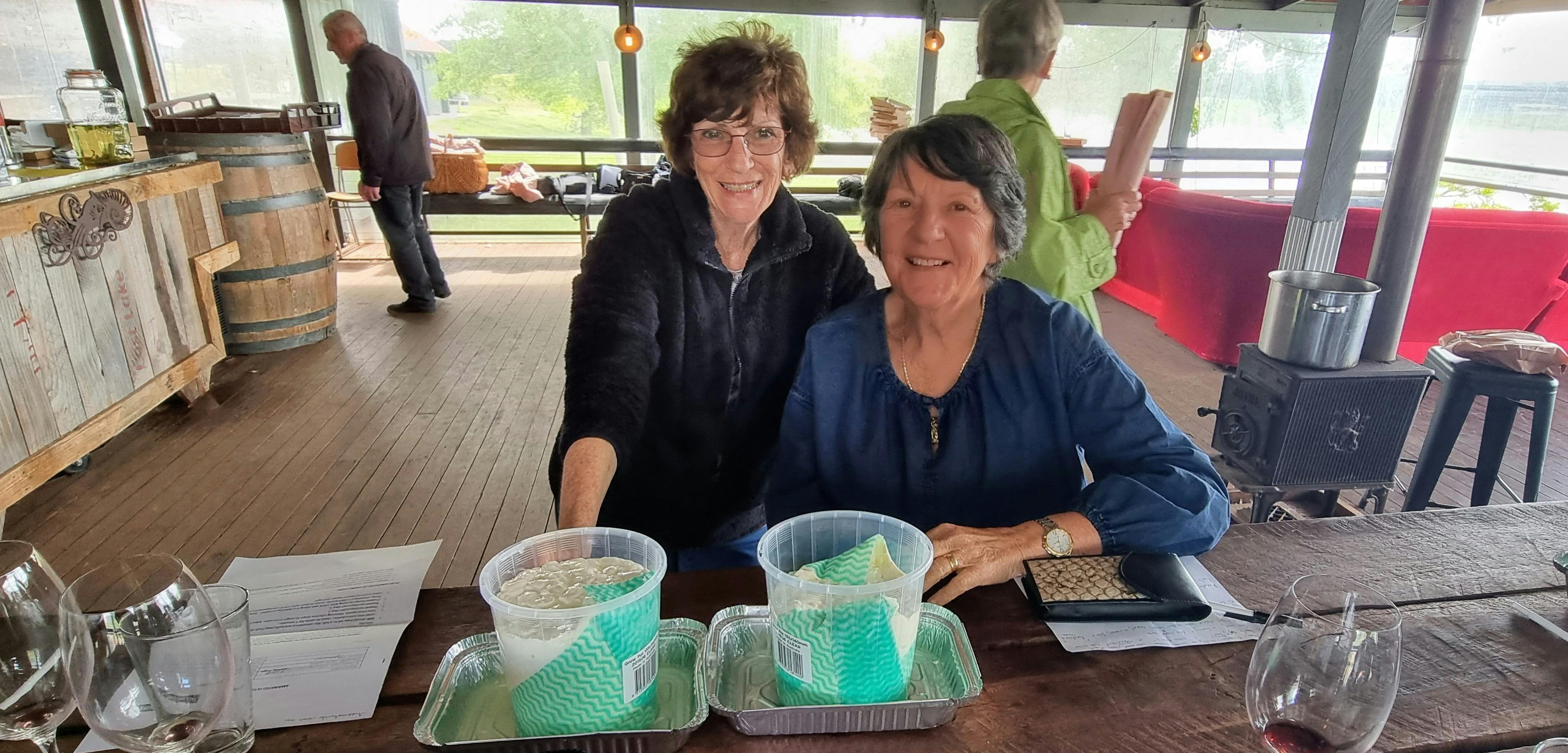 2 Ladies showing their cheesemaking skills