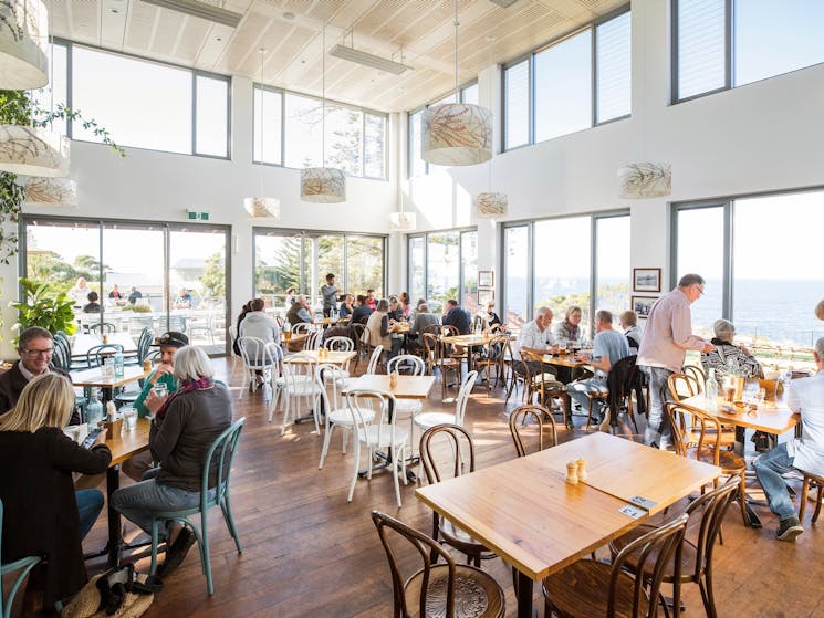 Diners enjoying food and drink at Tathra Hotel, Tathra