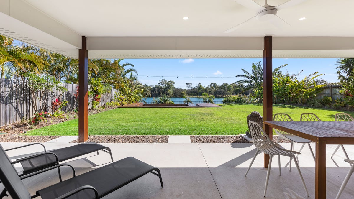 Covered private outdoor living with views out to Lake Kalvert