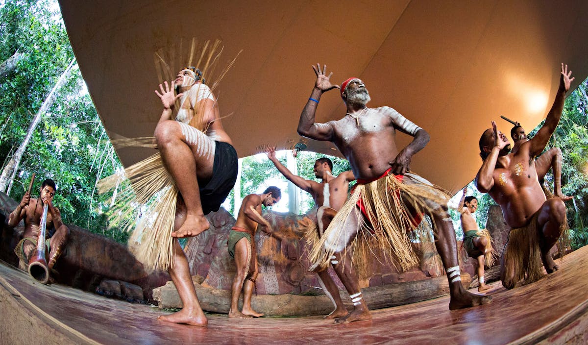 A group of Aboriginal Australian dancers performing traditional dance at Rainforestation Nature Park