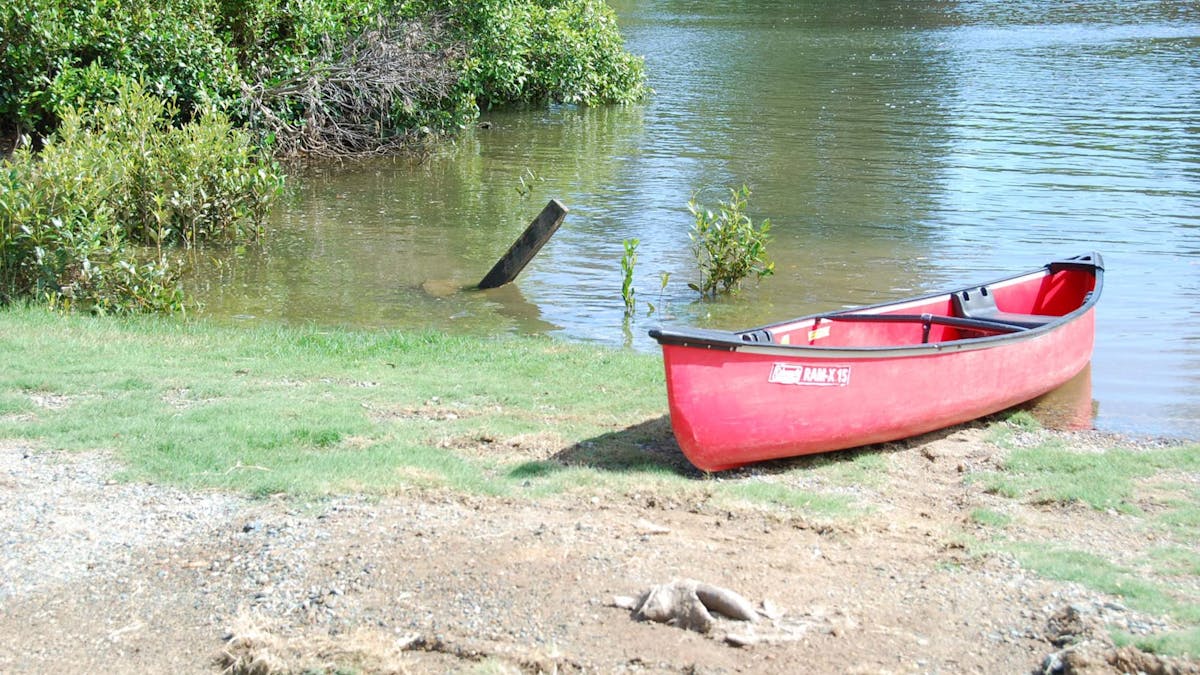 A canoe ready to launch into the North Pine Dam from Leis Park A canoe ready to launch into the North Pine Dam from Leis Park