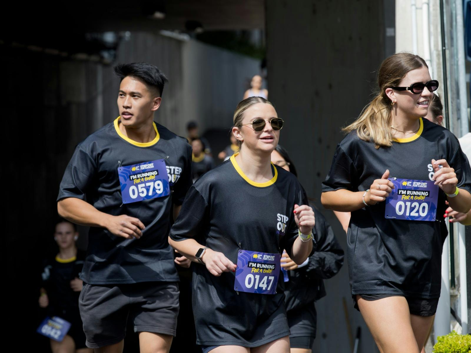 Participants running at Royal Randwick Racecourse for Step Out for Cancer