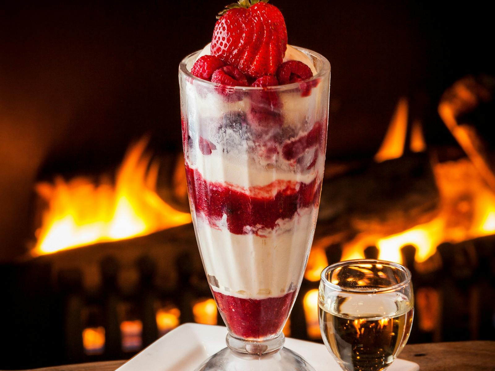 fresh berries and icecream enjoyed by the fire
