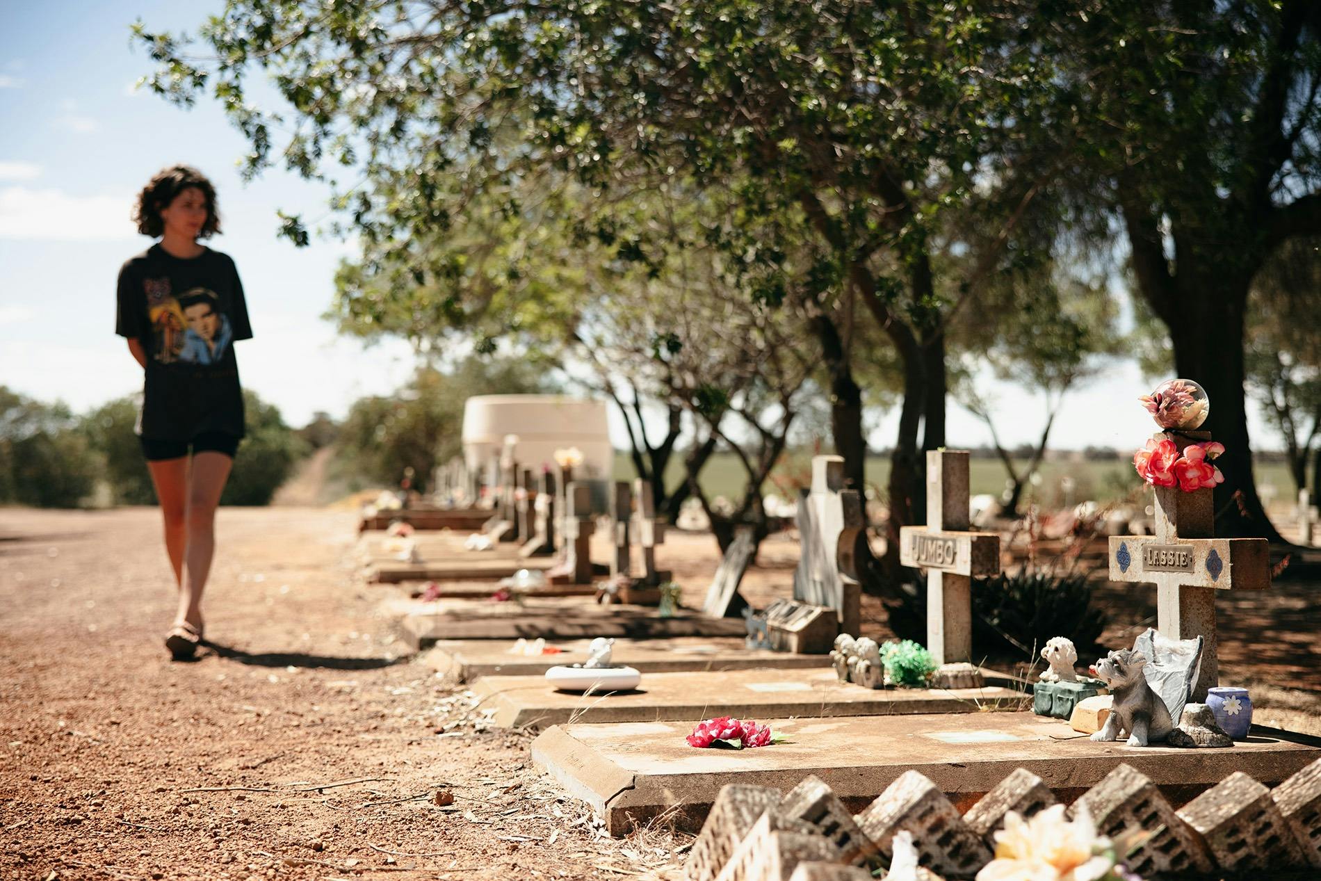 Lady walking through Corrigin Dog Cemetery in Corrigin