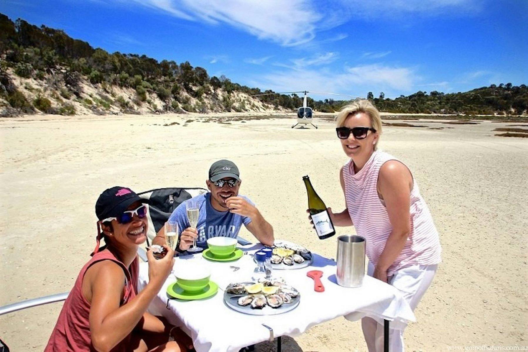 Lunch on a secluded beach access via helicopter