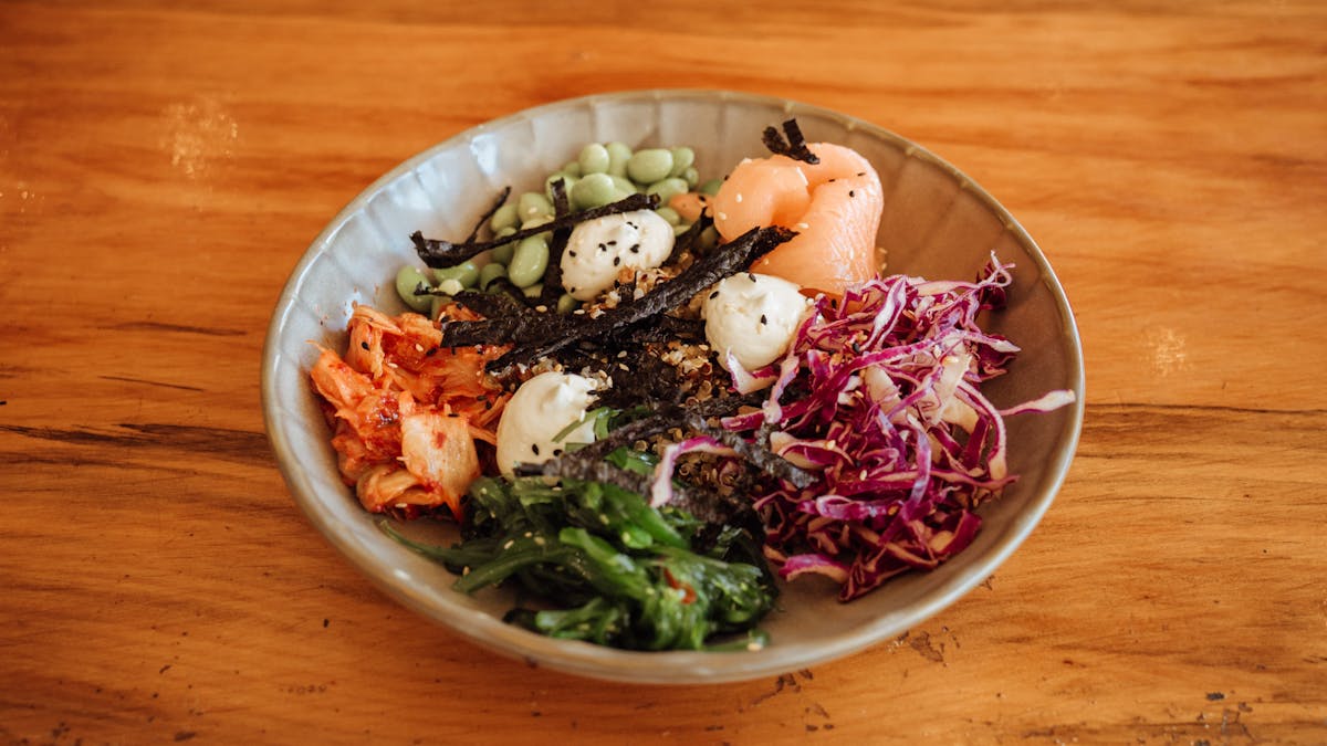 Smoked salmon poke bowl with kimchi, edamame, seaweed, cabbage and nori at Sidewalk Café