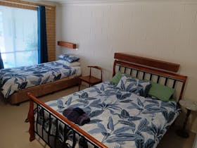 Inside one of the Toogoolawah Motel rooms - queen bed and single bed