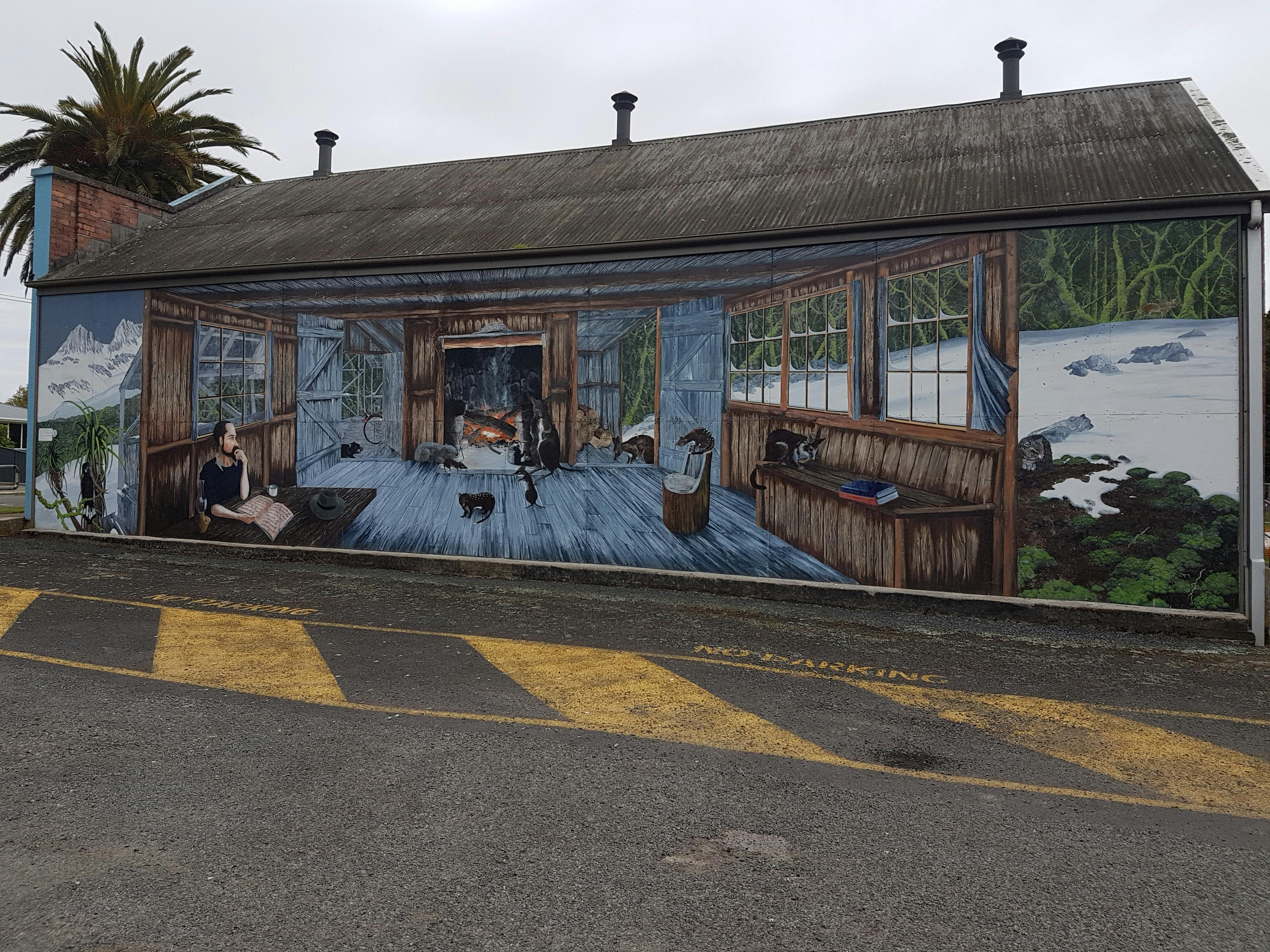 The mural in the car park in Sheffield depicting Weindorfer sitting in his Waldheim home.
