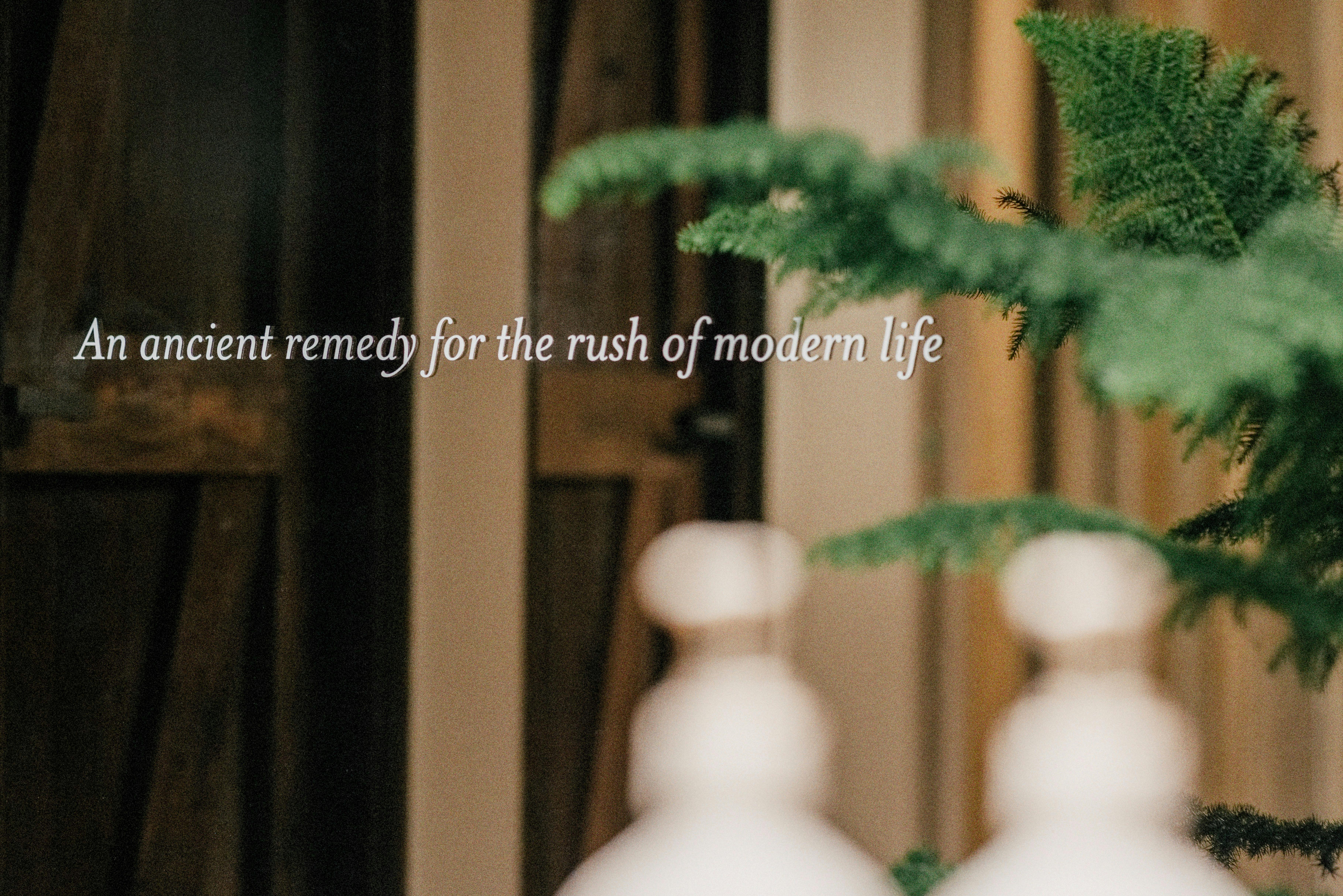 text reading "an ancient remedy for the rush of modern life" on a bronzed mirror.