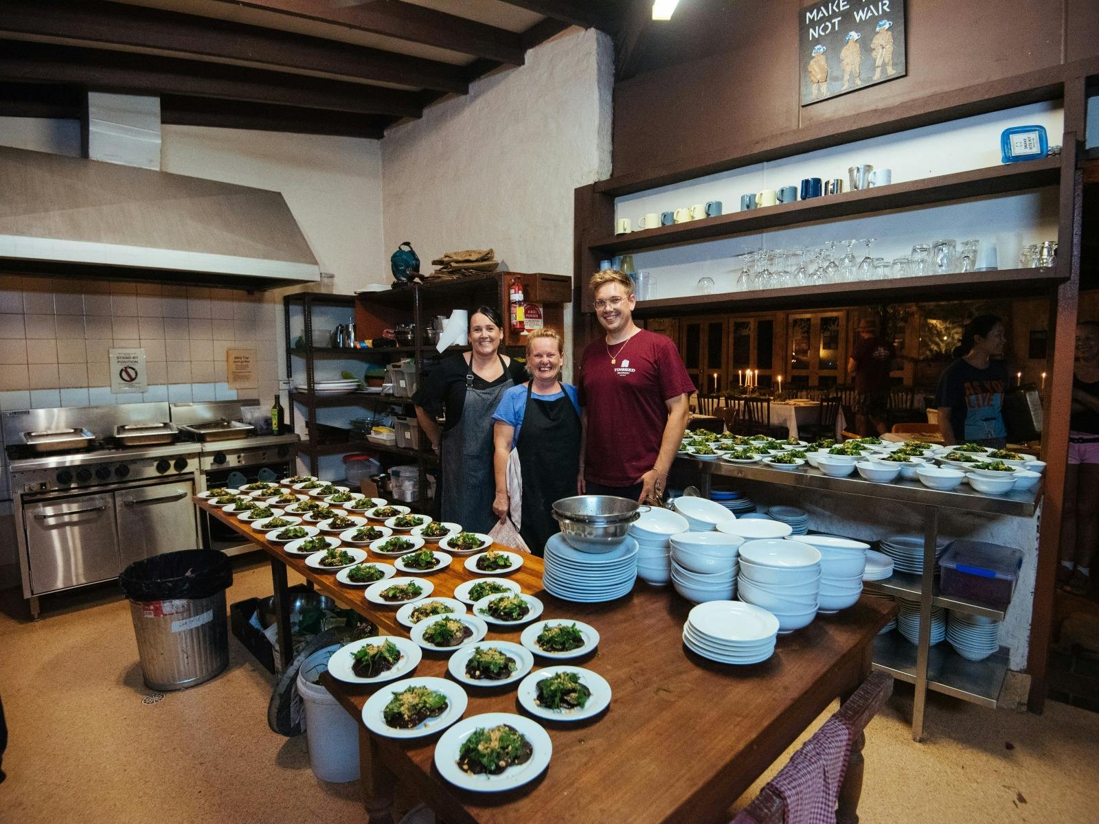 Chefs and Caterers stand in the commercial kitchen at Wangat Lodge with meals ready for event