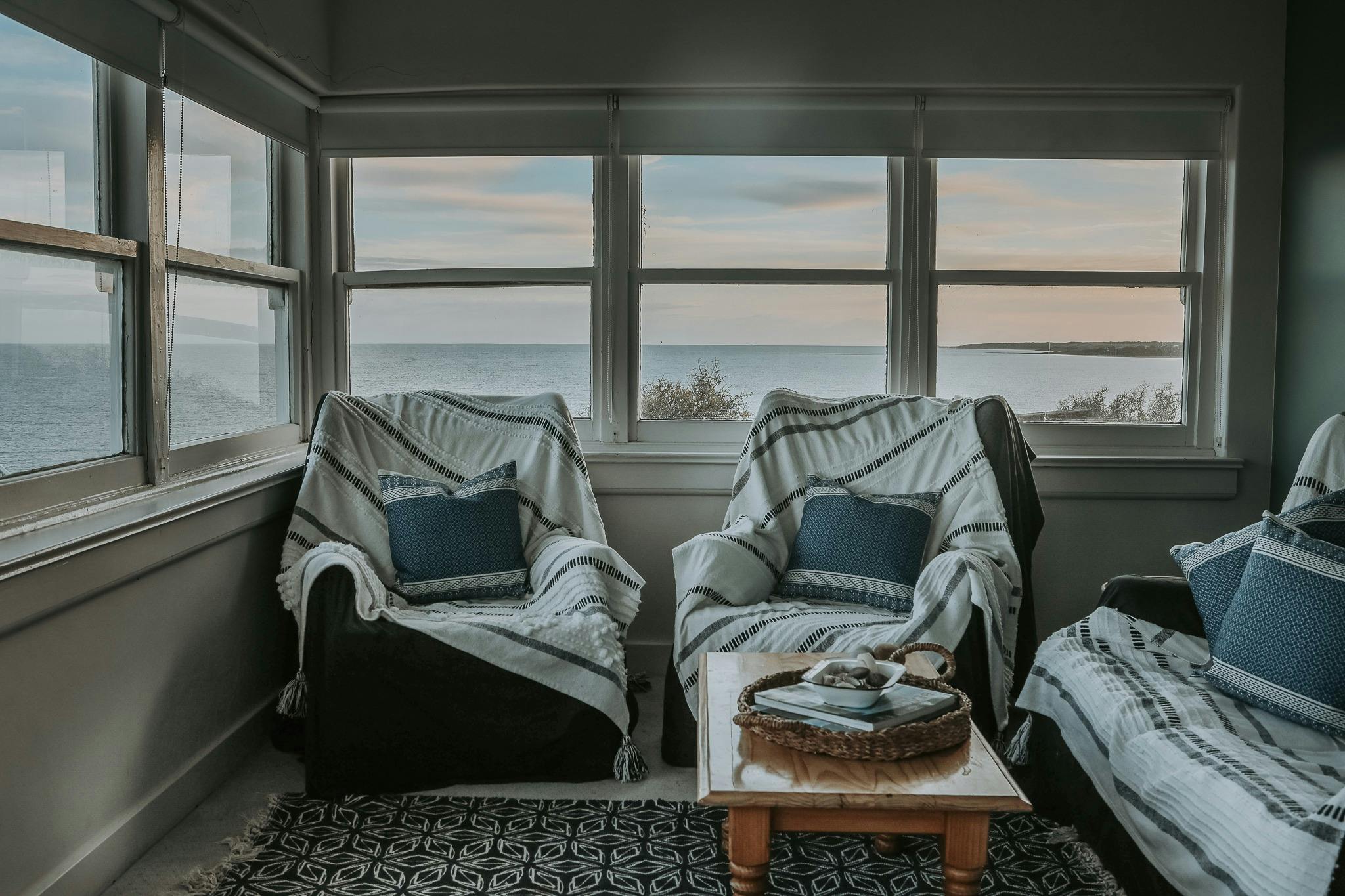 Sunroom beneath the lighthouse, perched on the clifftop of Low Head