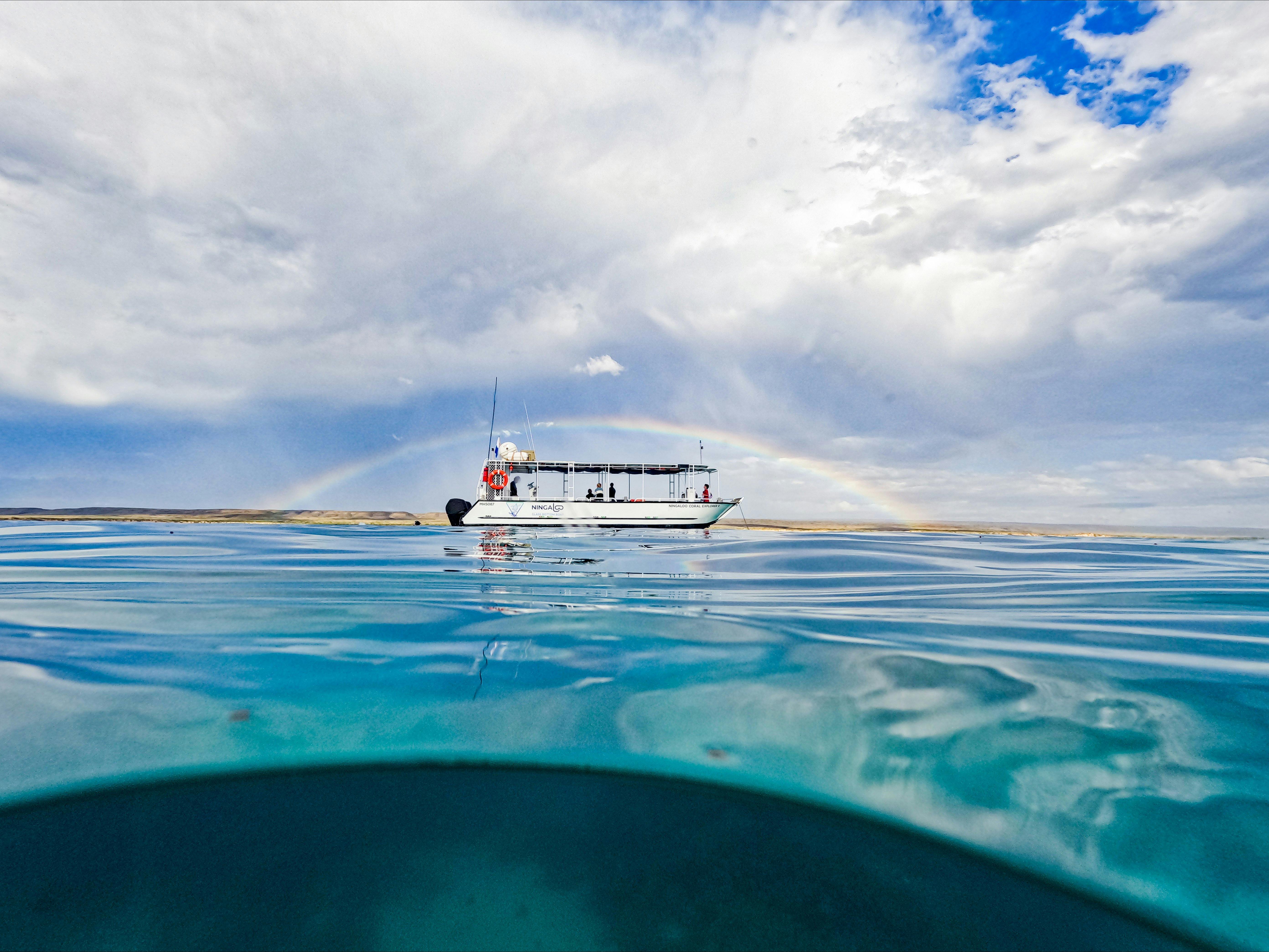 Ningaloo Glass Bottom Boat under a rainbow