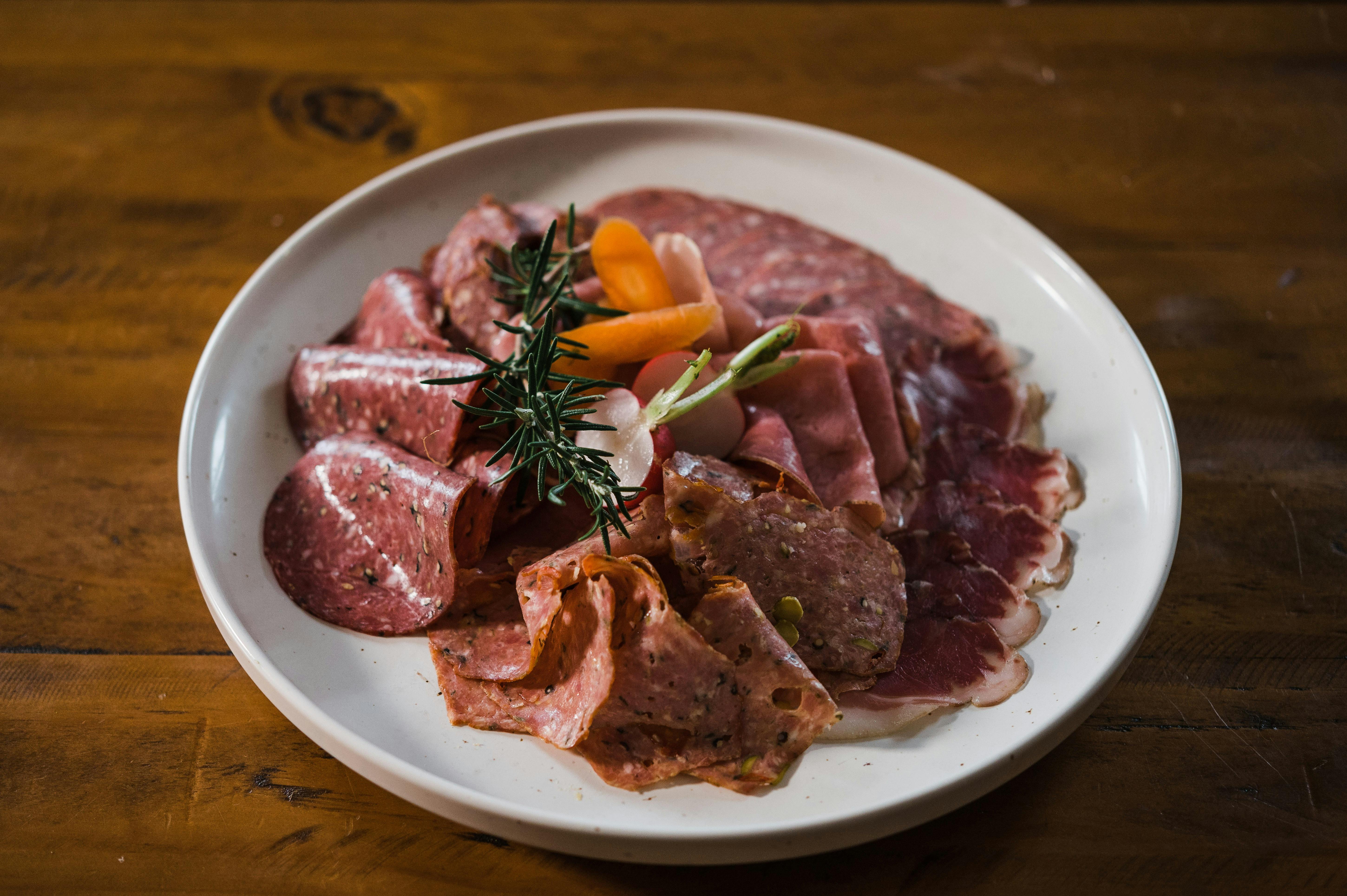 Image shows a grazing platter of gourmet smallgoods meats