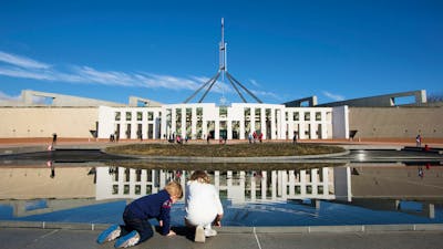 Children looking in the pond