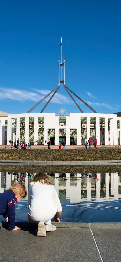 Children looking in the pond