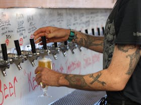 Man pouring a glass of beer