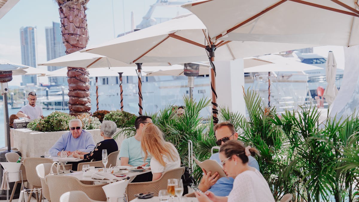 Marina-side dining at MĀRE beside La Luna Beach Club