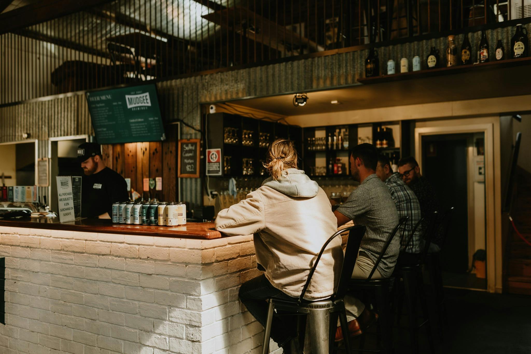 Mudgee Ale Trail tour participants sitting at a local brewery bar