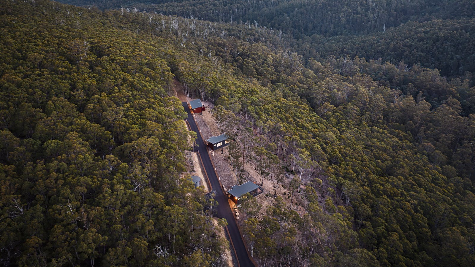 The Three Cabins Perched On The Hillside