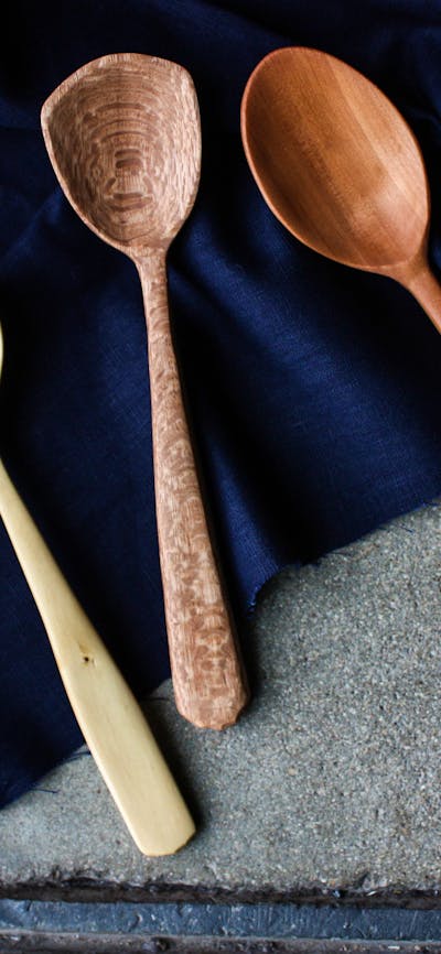 hand carved wooden spoon, and blown bowl