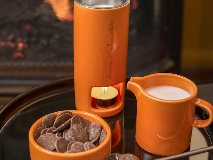 Hot chocolate by a fire