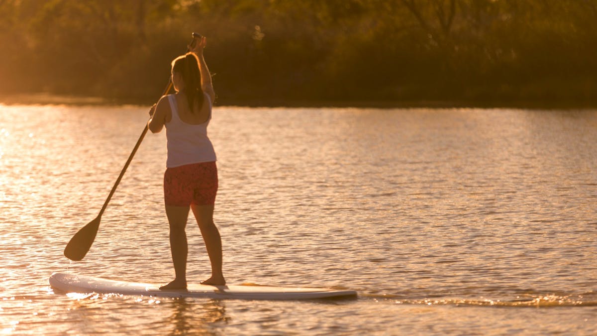 Paddle boarder on the Birdsville Billabong