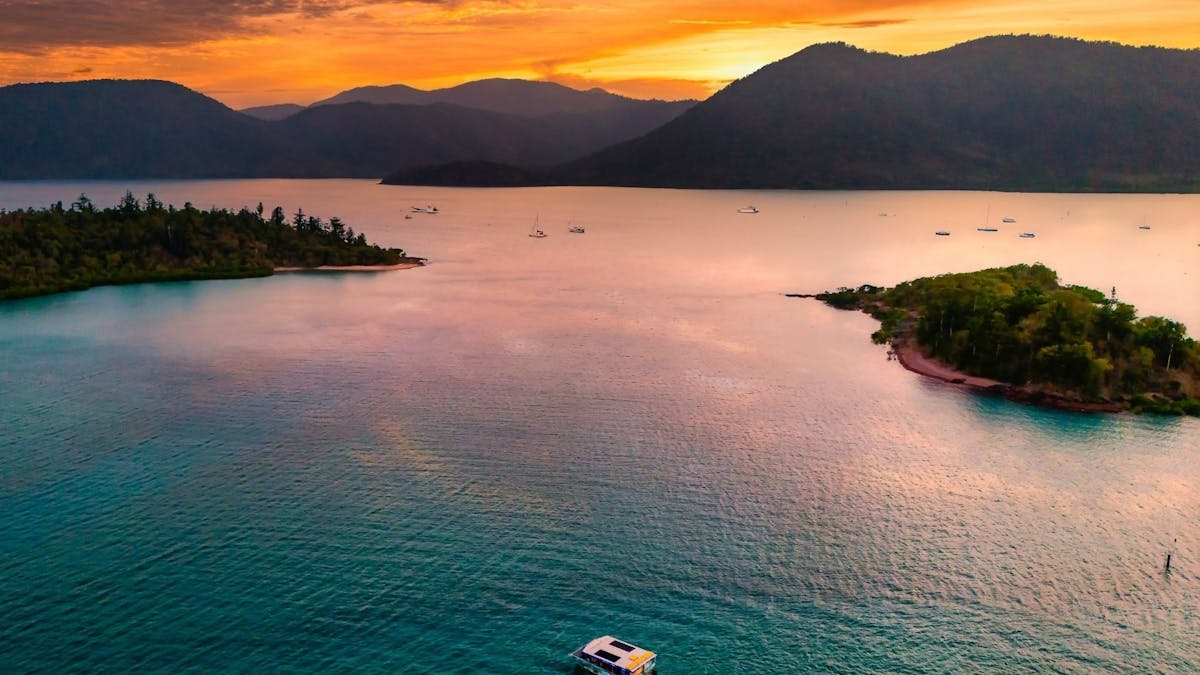 Glass Bottom Boat cruising through sunset