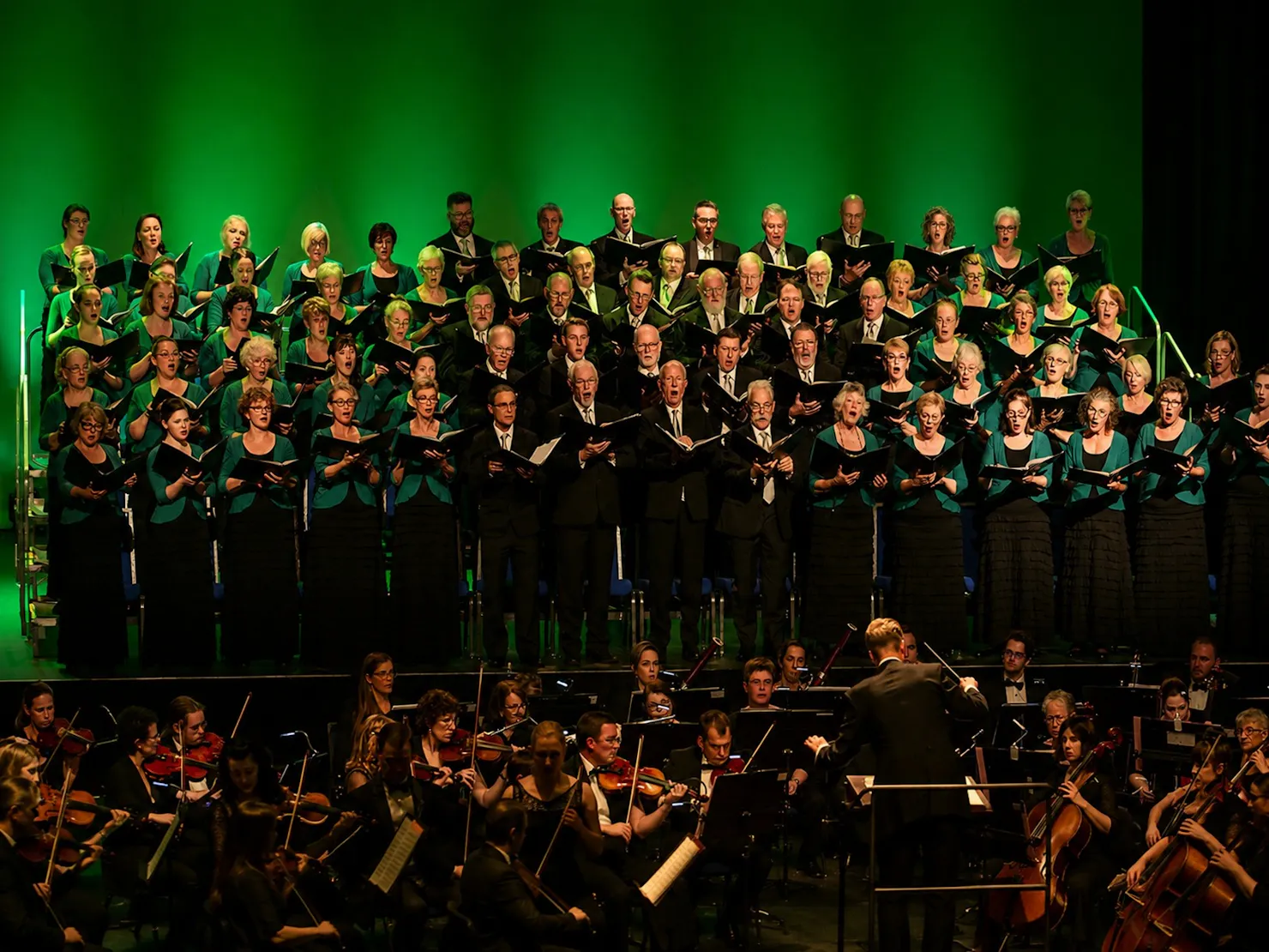 Orchestra with Oriana Choir, green lighting