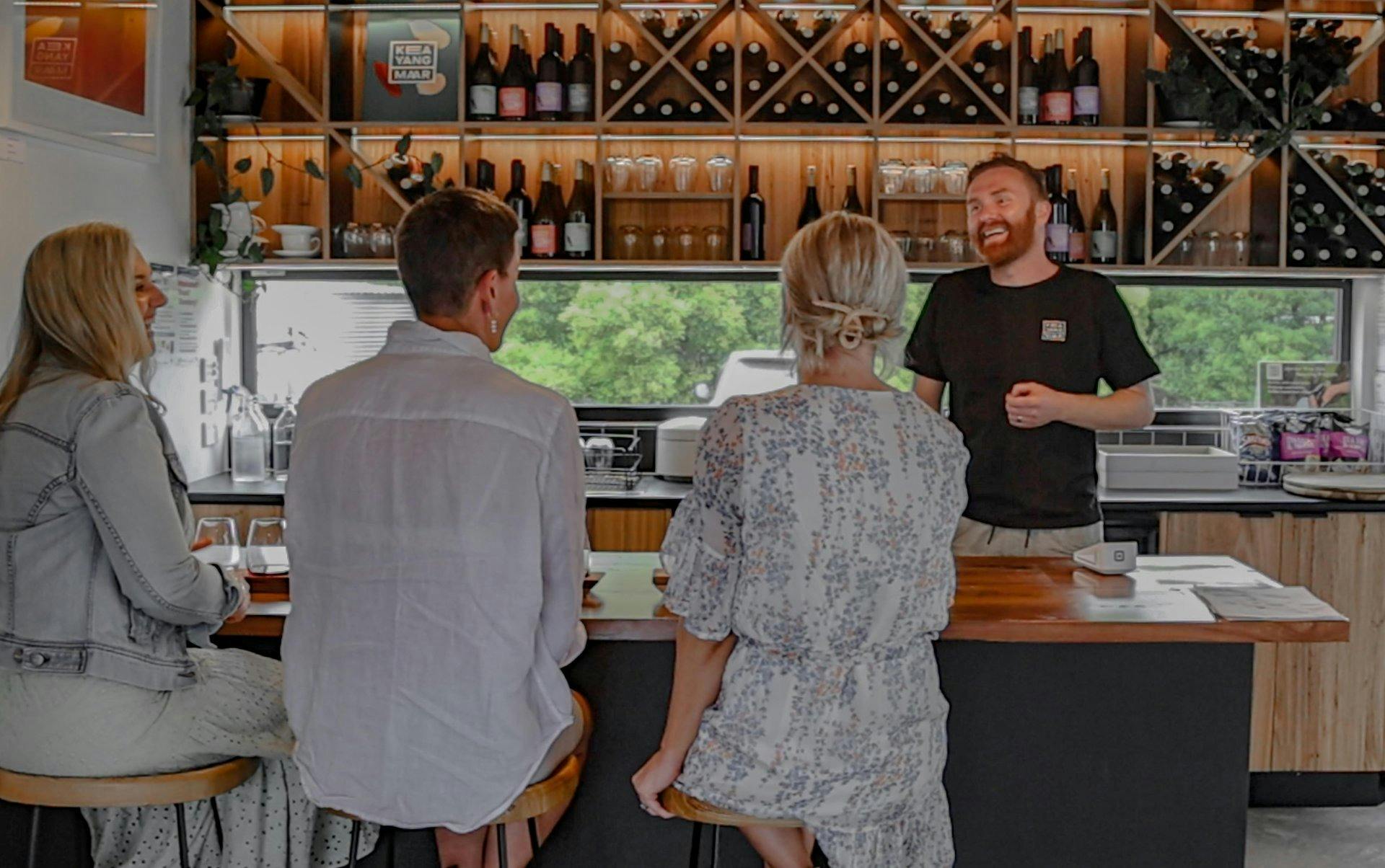 3 female customers at a wine tasting