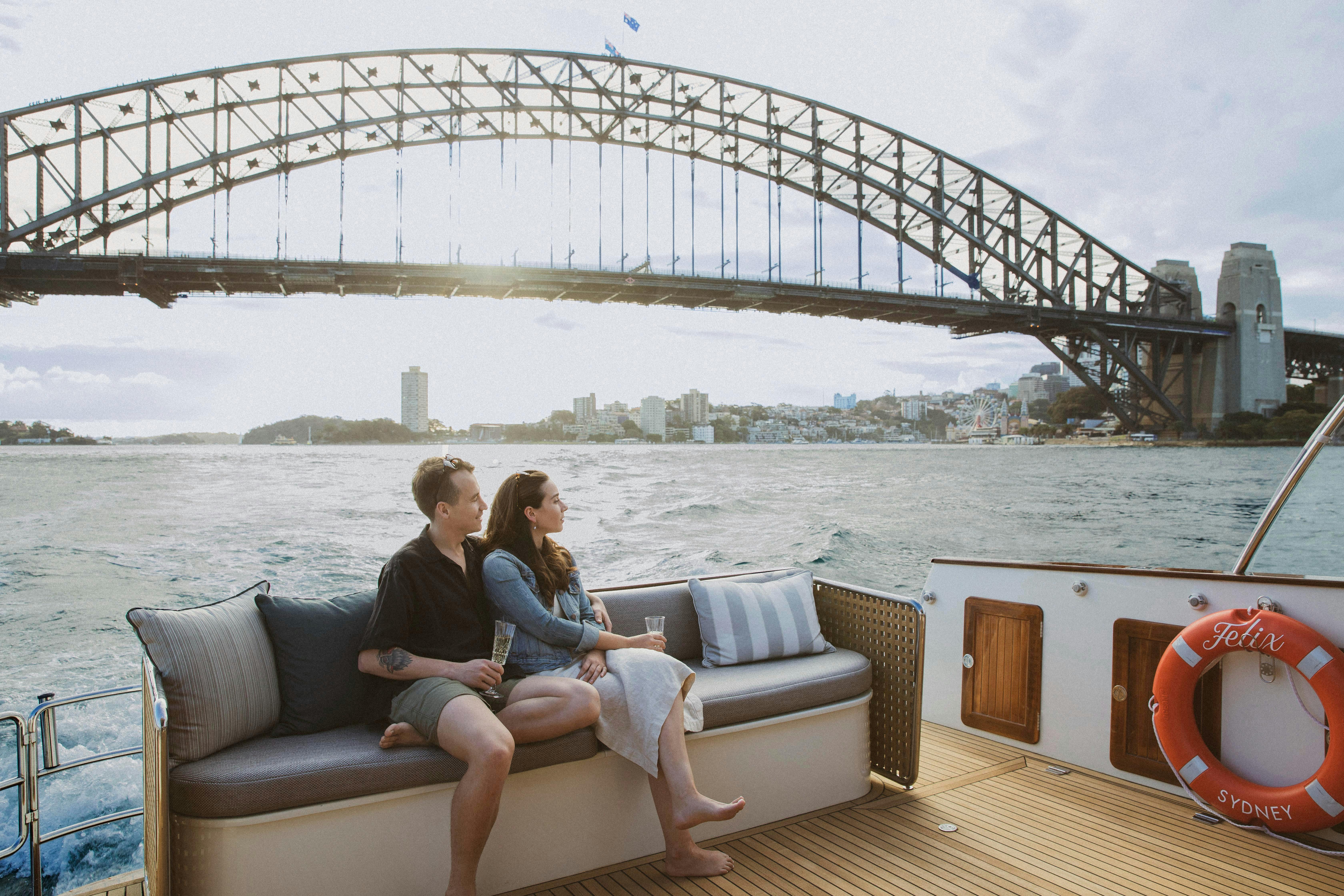 Boat cruising past the Sydney Harbour Bridge