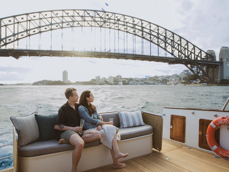 Boat cruising past the Sydney Harbour Bridge
