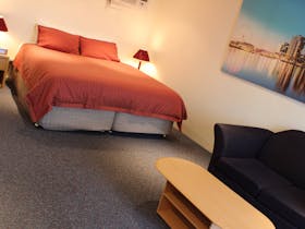 Plush King bed, Large TV, Superior quality room amenities, spacious and quiet, off street parking